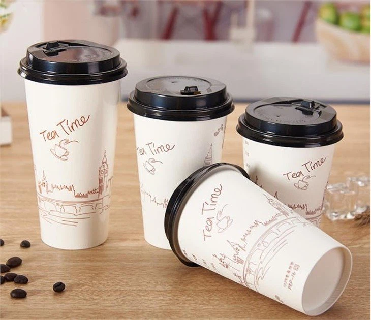 paper cups with black lids